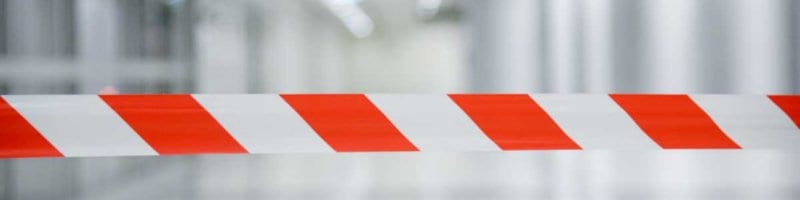 red and white lines barrier tape