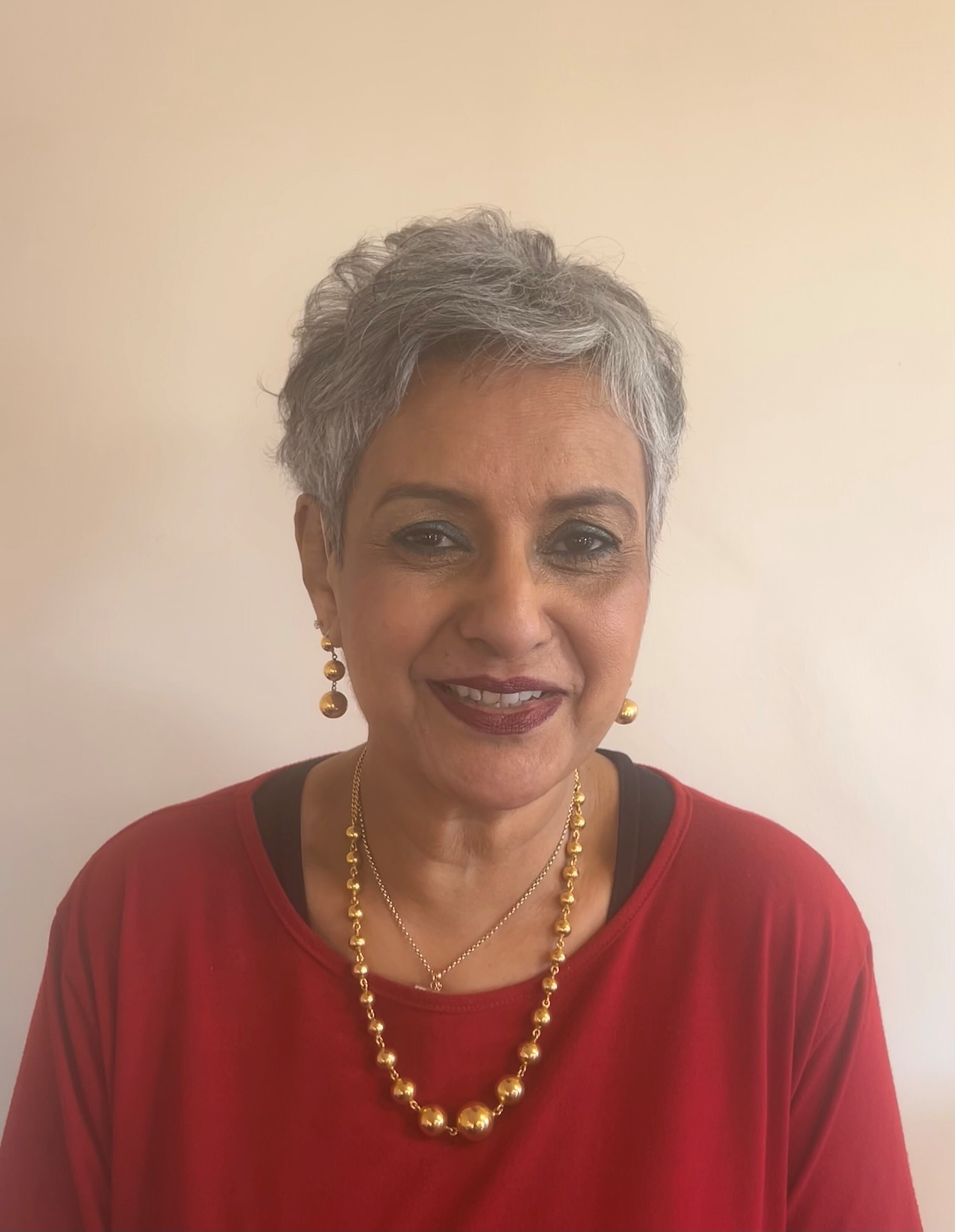 Image of guest speaker: Nadra Ahmed CBE Logo