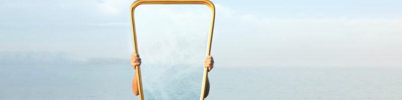 someone holding miror