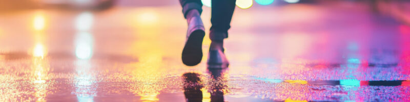 feet walking through puddle